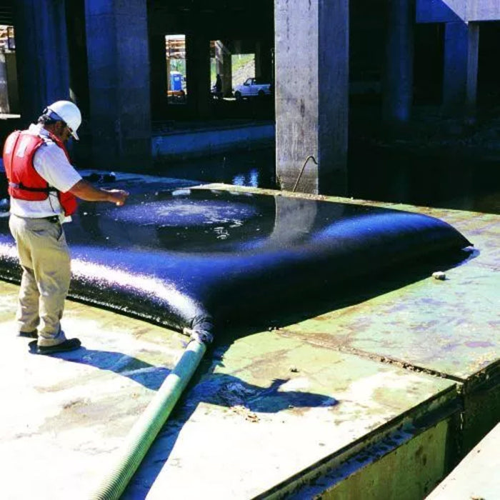 A man points at the Ultra-Dewatering bag
