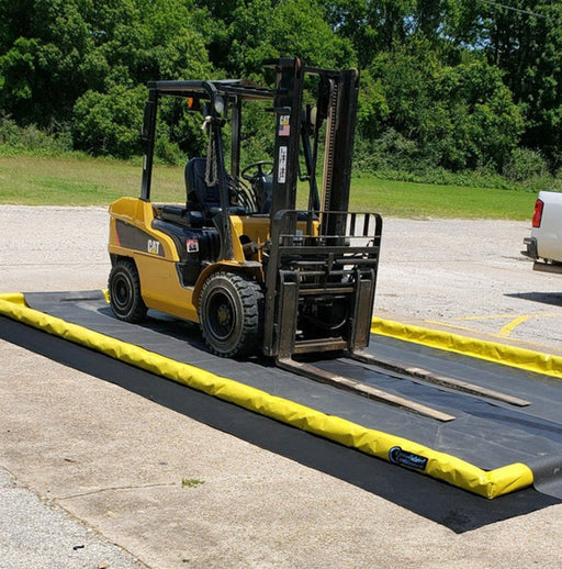 A berm pad with a ProFlex Foam Wall Berm and a forklift on top of track gurads