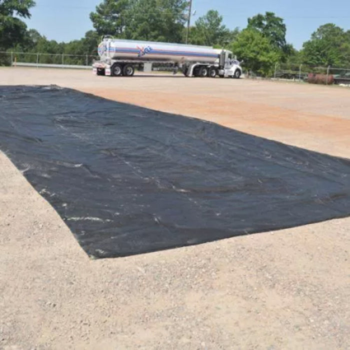 Large berm pad on dirt site with 18 wheeler in the background