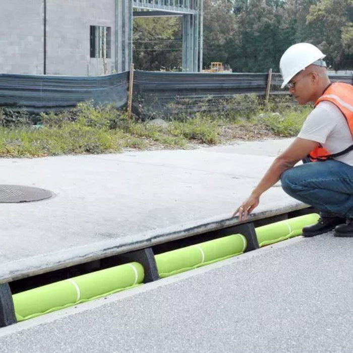 A man installs an Ultra-Curb Guard Plus Model