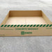 A cardboard box with shallow sides, used as a concrete washout berm economy model