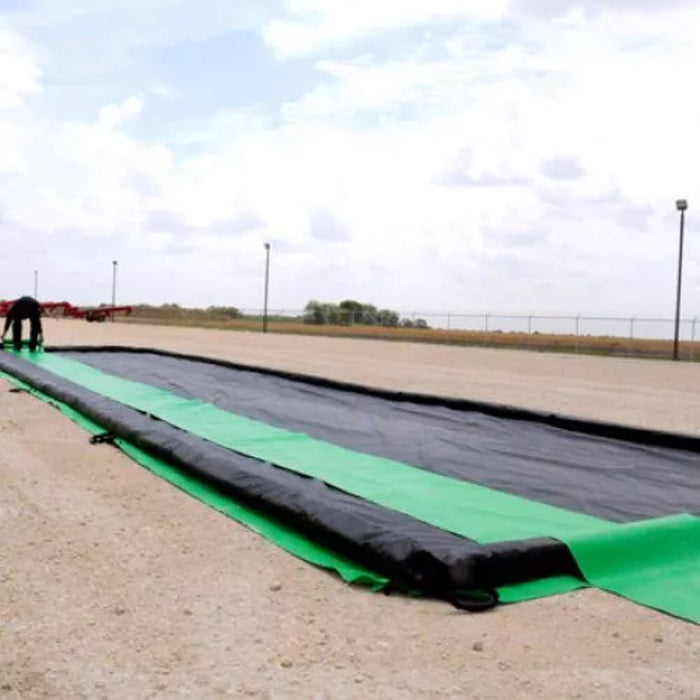 A large berm with long fluorescent green track guards