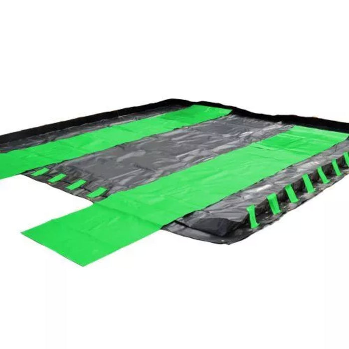 A square black berm with fluorescent green track guards
